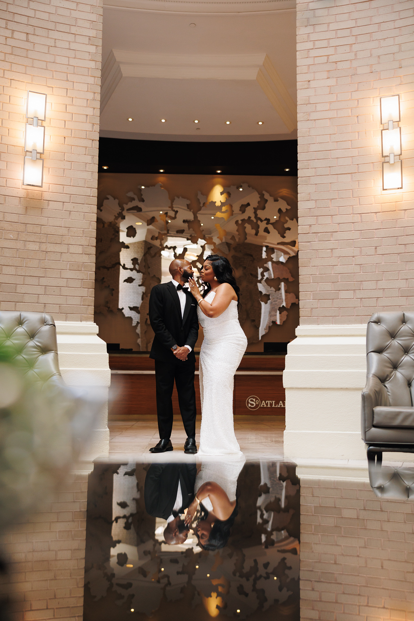Couple during engagement session at The Georgian Terrace hotel in Atlanta, photographed by B. Smitty Photos