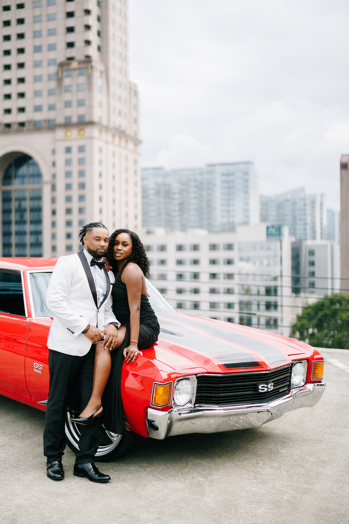 Couple during engagement session with Atlanta skyline views, photographed by B. Smitty Photos