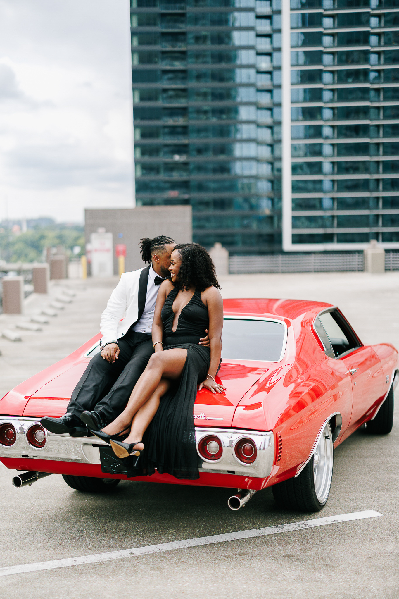 Couple during engagement session with Atlanta skyline views, photographed by B. Smitty Photos