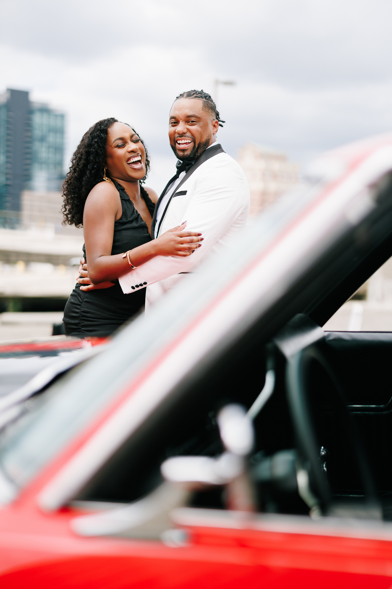 Couple during engagement session with Atlanta skyline views, photographed by B. Smitty Photos