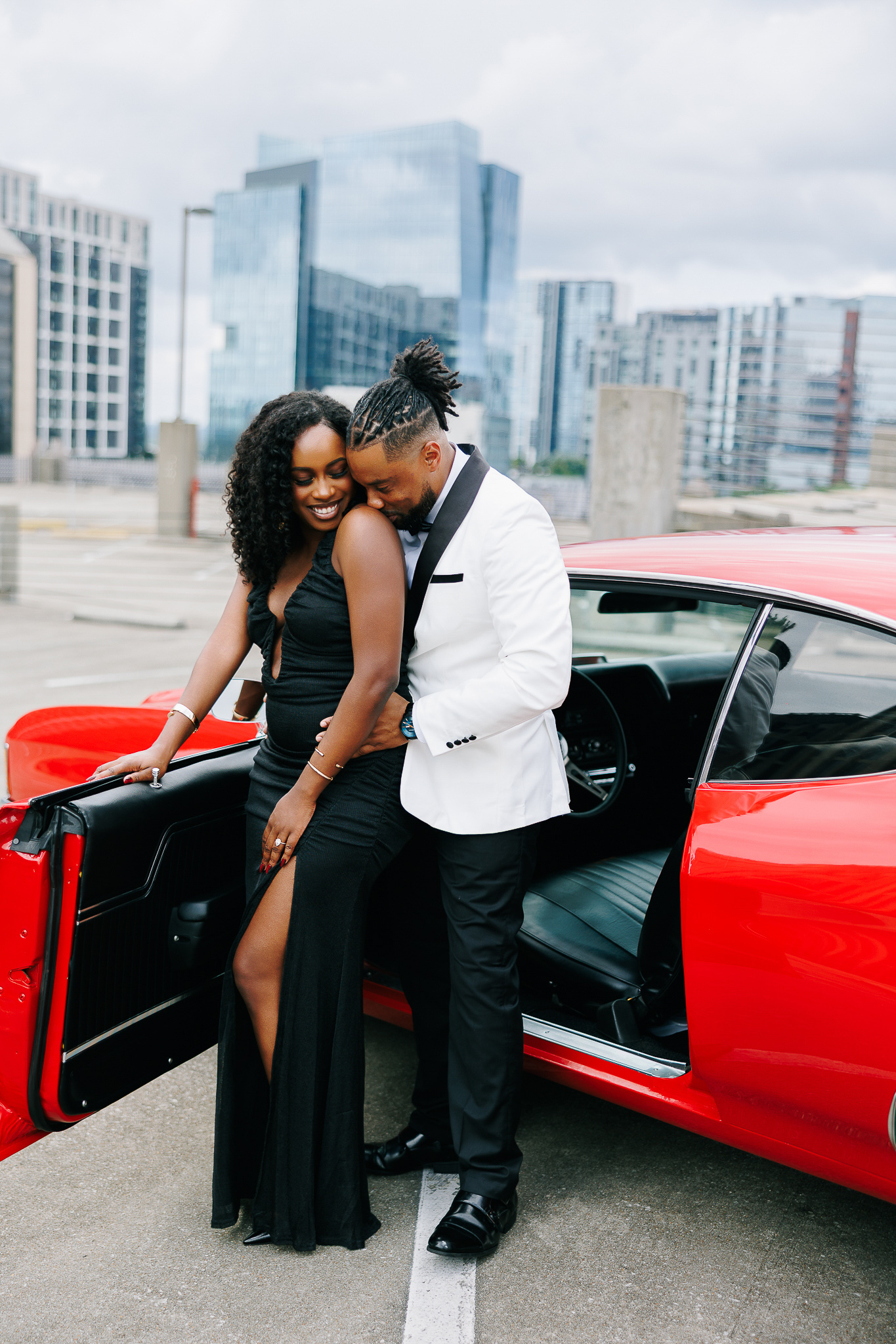 Couple during engagement session with Atlanta skyline views, photographed by B. Smitty Photos