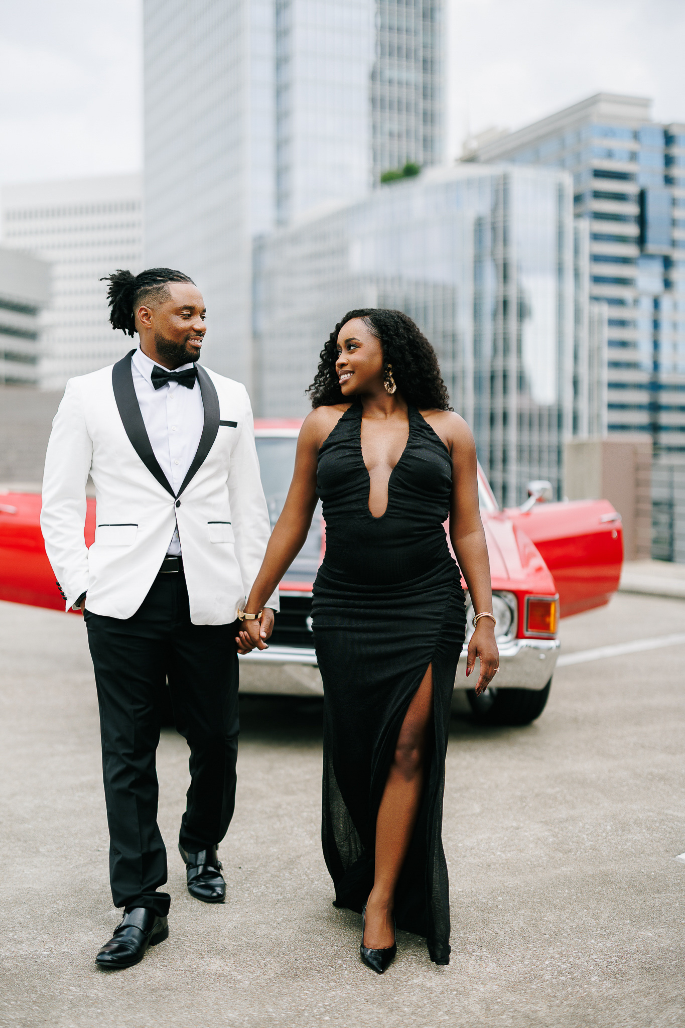 Couple during engagement session with Atlanta skyline views, photographed by B. Smitty Photos
