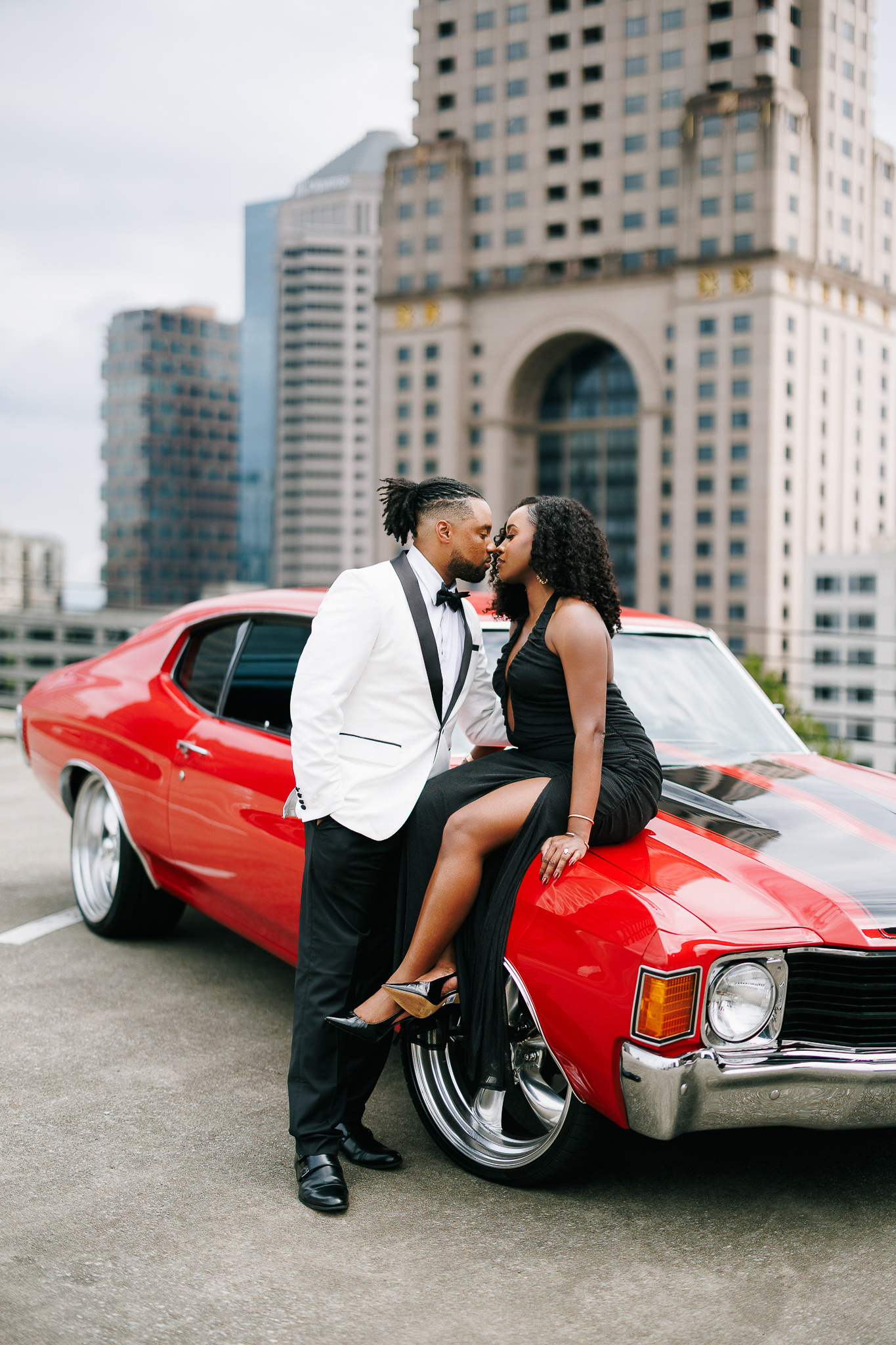 Couple during engagement session with Atlanta skyline views, photographed by B. Smitty Photos